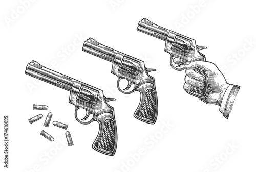 Hand holding revolver with bullets isolated on white background.