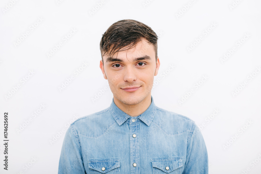 Young caucasian man portrait over white background. Young caucasian man portrait over white background.