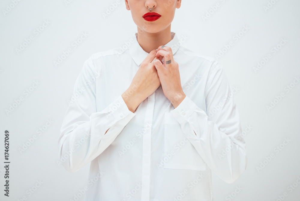 Woman buttoning shirt Woman buttoning shirt