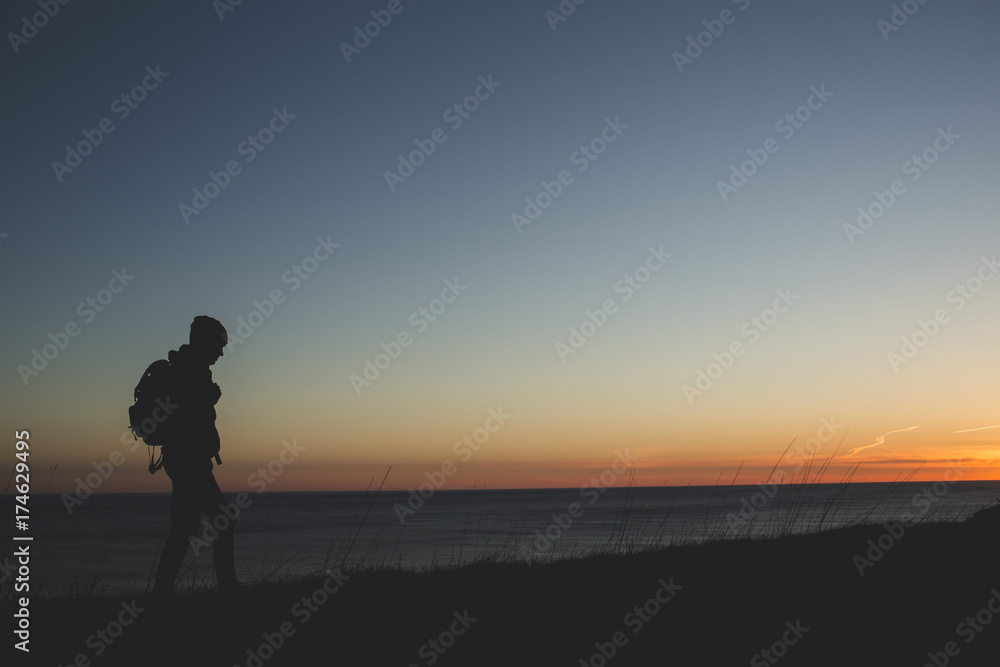 Hiker On Cliff At Sunset Hiker On Cliff At Sunset