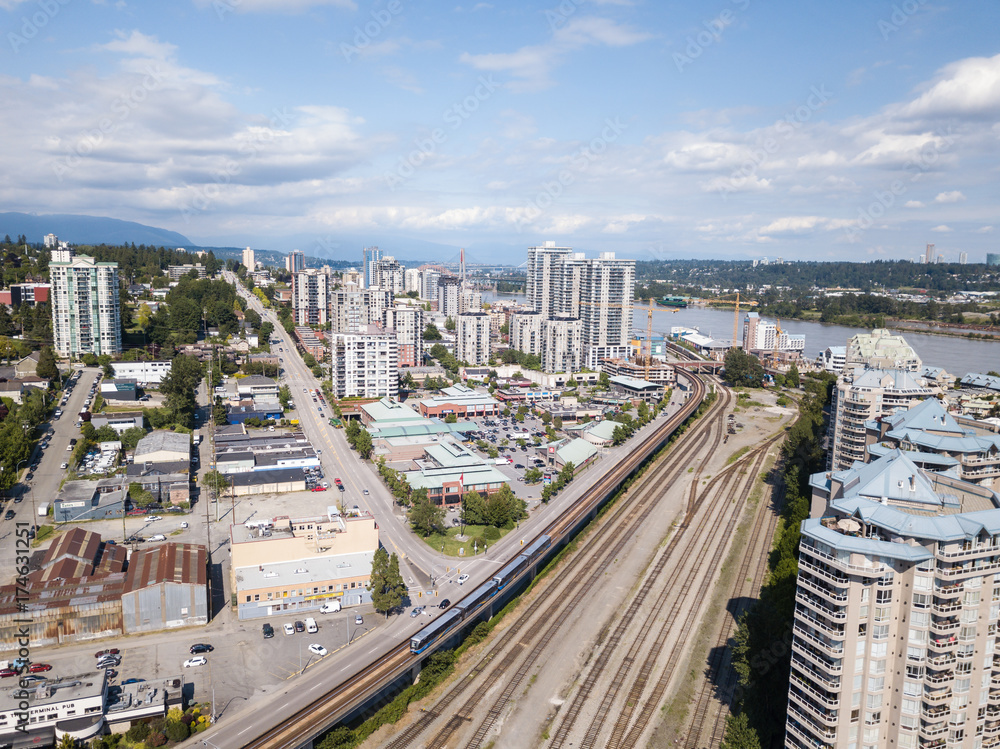 New Westminster, Greater Vancouver, BC, Canada - June 11, 2017 - Aerial view of the city, shopping mall and railroad tracks.