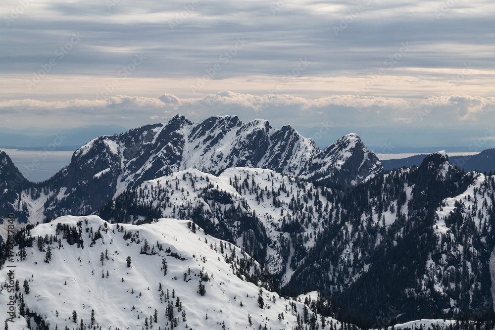 Beautiful aerial landscape view on the snow covered mountains. Taken North of Vancouver, British Columbia, Canada. Beautiful aerial landscape view on the snow covered mountains. Taken North of Vancouver, British Columbia, Canada.