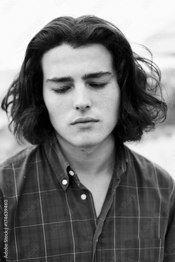Black and white: sad teenage boy Black and white: sad teenage boy