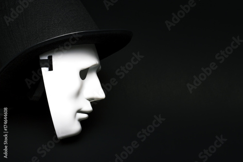 White human mask in hat