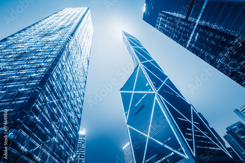 directly below of modern financial skyscrapers in central Hong Kong,blue toned,china.