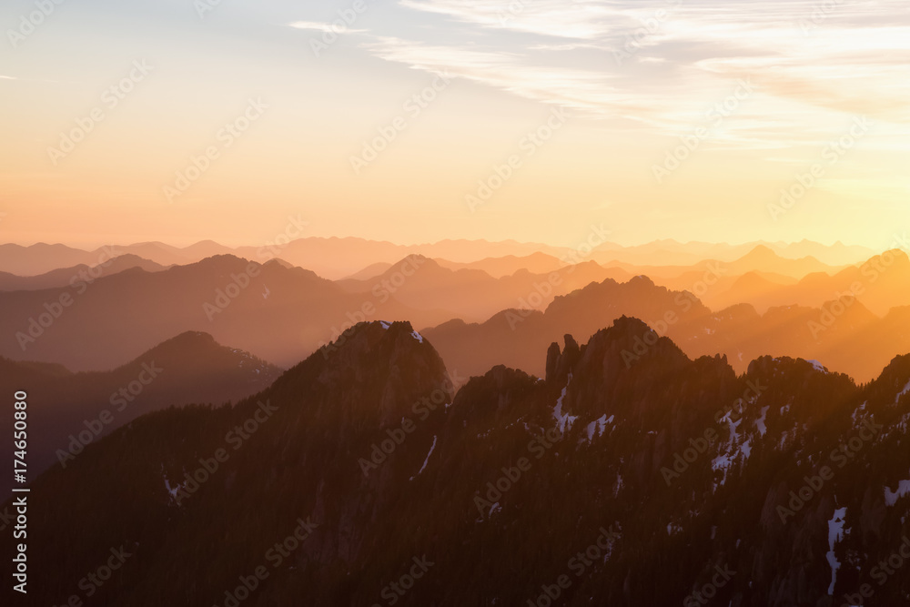Beautiful rugged mountain landscape view during a golden sunset. Taken near Tofino, Vancouver Island, British Columbia, Canada.