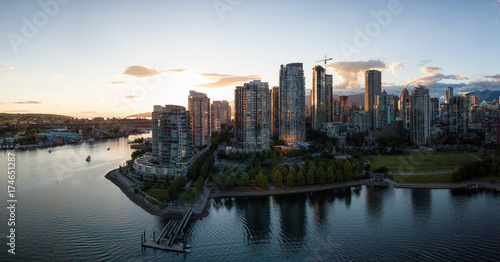 Aerial Panorama of Downtown City at False Creek, Vancouver, British Columbia, Canada. Taken during a bright sunset.