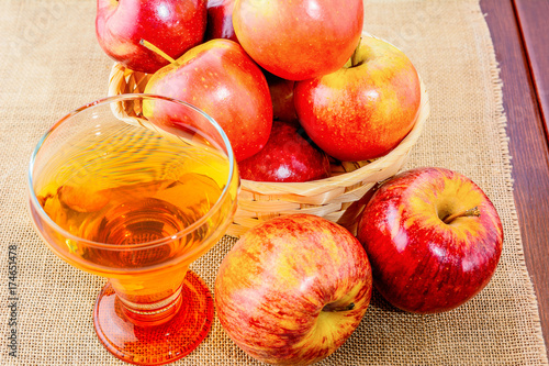 Apple cider glass and red apples