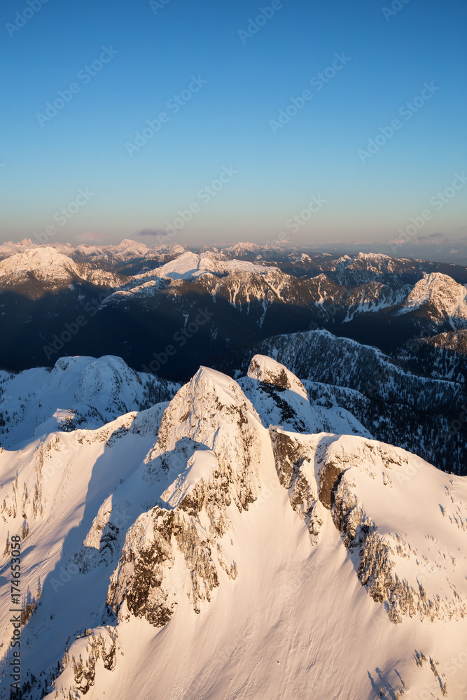 Aerial landscape view of The Lions Peak. Picture taken on the North Shore Vancouver Mountains, BC, Canada.