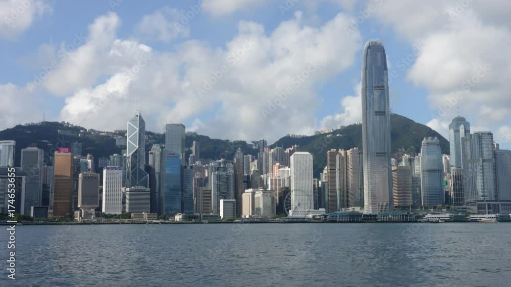 Hong Kong skyline at sunrise in morning. View of Kowloon pier, avenue of stars in Tsim Sha Tsui. Victoria Harbour, Central, Causeway Bay cityscape. Passenger cargo ship traffic transport. Time lapse Hong Kong skyline at sunrise in morning. View of Kowloon pier, avenue of stars in Tsim Sha Tsui. Victoria Harbour, Central, Causeway Bay cityscape. Passenger cargo ship traffic transport. Time lapse