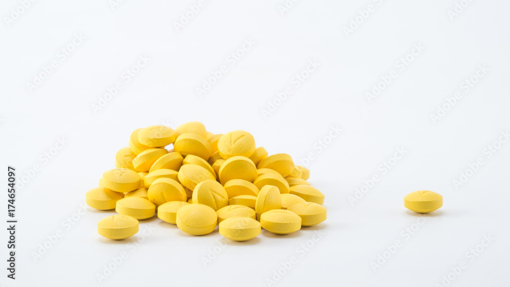 yellow tablets stack on white background yellow tablets stack on white background