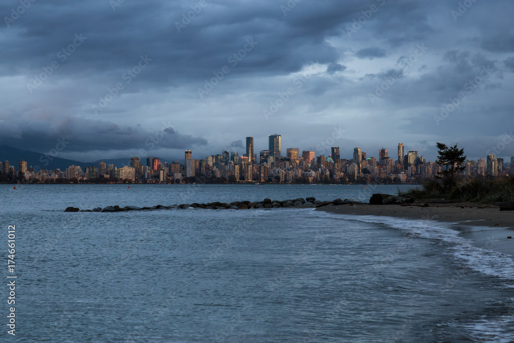Vancouver Downtown, BC, Canada, viewed from Jericho Beach during storm weather and high water levels.