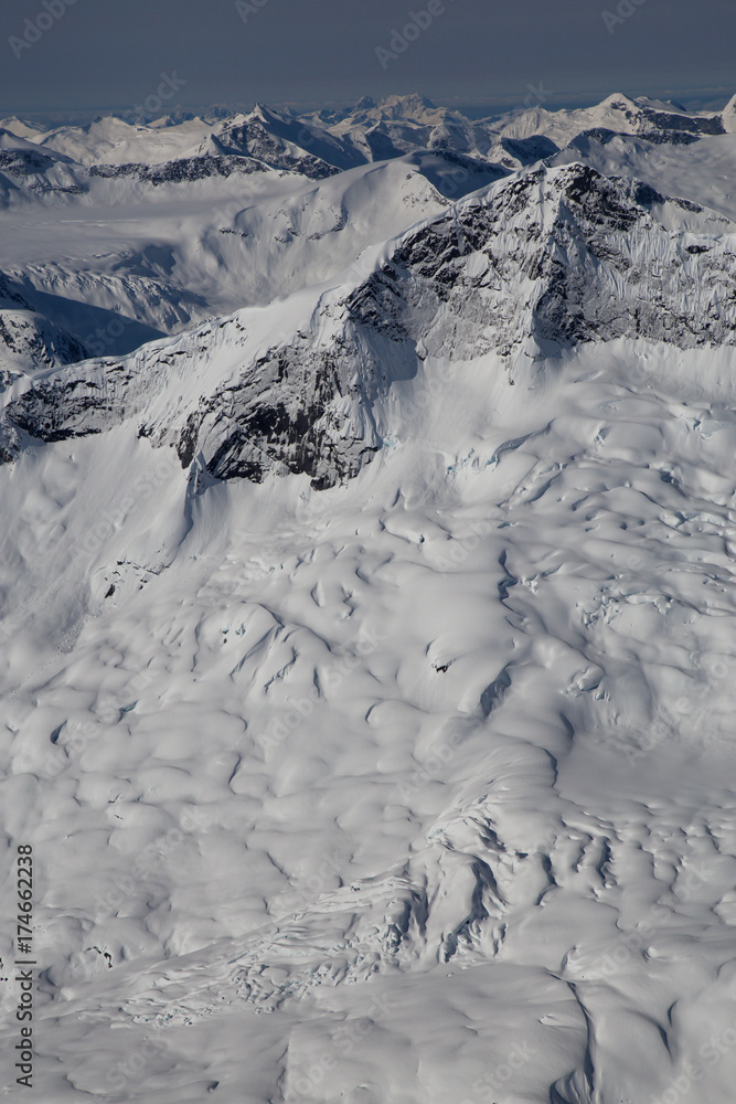 Aerial landscape view of the mountains. Taken far remote North West from Vancouver, British Columbia, Canada. Aerial landscape view of the mountains. Taken far remote North West from Vancouver, British Columbia, Canada.