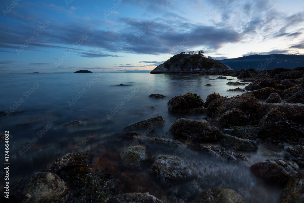 Beautiful sunset at the rocky beach. Taken in Whytecliff Park, Horseshoe Bay, West Vancouver, British Columbia, Canada. Beautiful sunset at the rocky beach. Taken in Whytecliff Park, Horseshoe Bay, West Vancouver, British Columbia, Canada.