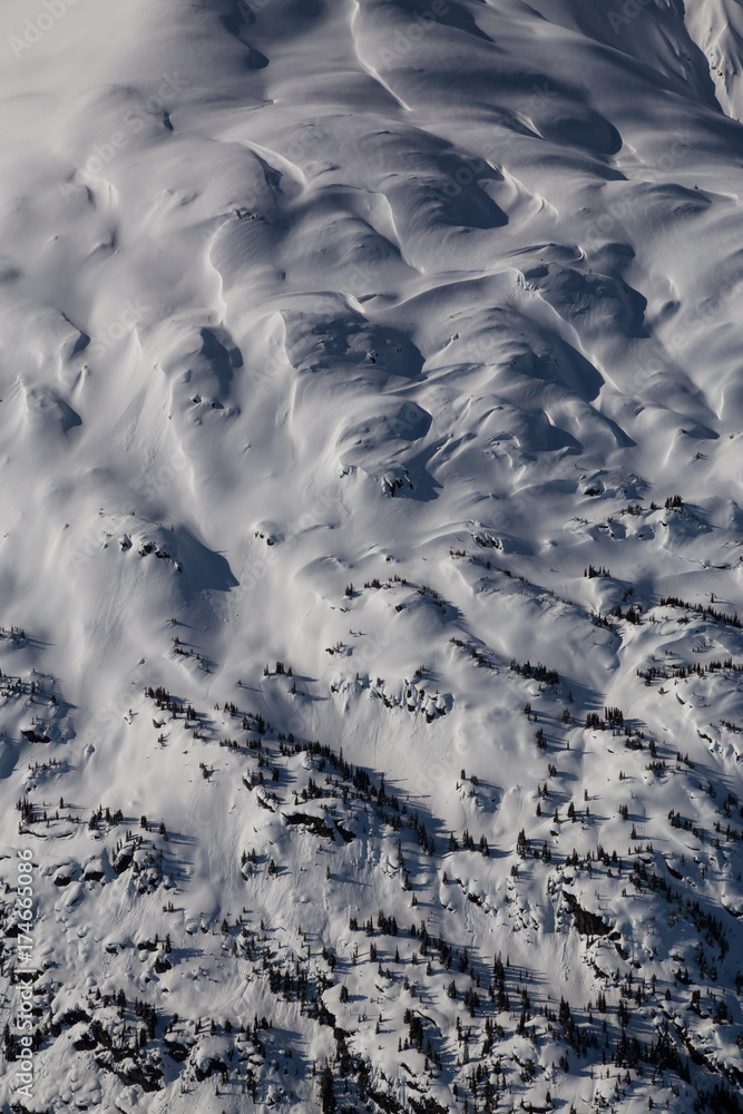 Aerial landscape view of the mountains. Taken far remote North West from Vancouver, British Columbia, Canada. Aerial landscape view of the mountains. Taken far remote North West from Vancouver, British Columbia, Canada.