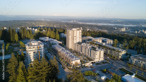 Aerial view of SFU on Burnaby Mountain, Vancouver, British Columbia, Canada. Taken during a bright sunset.