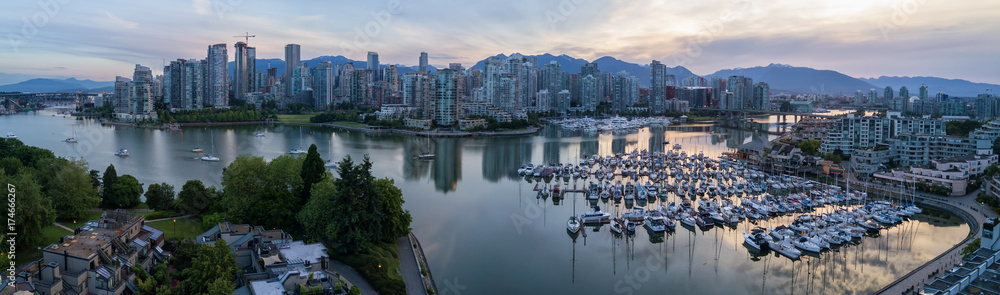 Panoramic City Skyline View of Downtown Vancouver around False Creek area from an Aerial Perspective. Taken in British Columbia, Canada, durin a colorful sunrise.