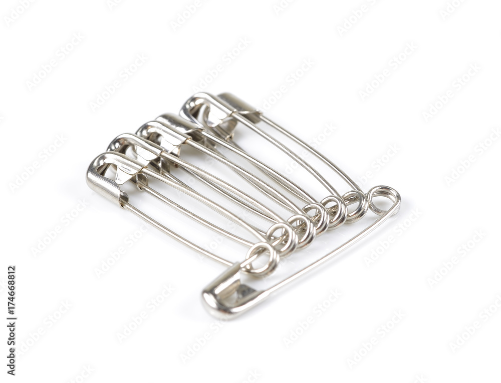 unch of safety pins on white background, shiny metal safety pin equipment clip on white unch of safety pins on white background, shiny metal safety pin equipment clip on white