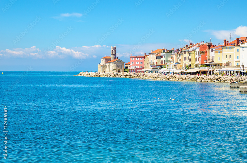 Chapel and colorful houses on the pier, Piran, Slovakia, Europe