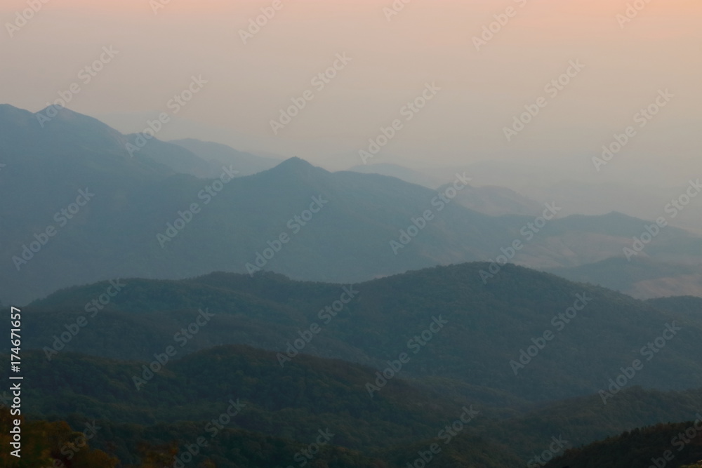 Beautiful twilight layers of silhouettes mountain in Chiang Mai , Thailand