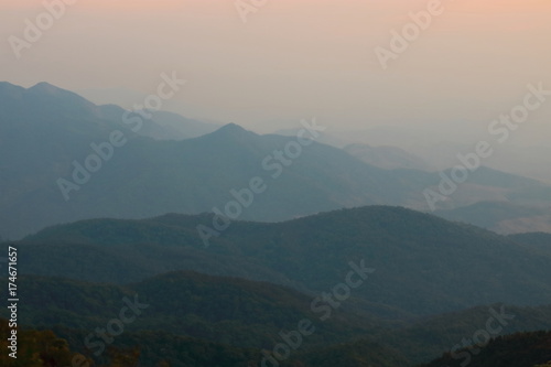 Beautiful twilight layers of silhouettes mountain in Chiang Mai , Thailand © tuaindeed