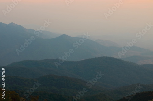 Beautiful twilight layers of silhouettes mountain in Chiang Mai , Thailand