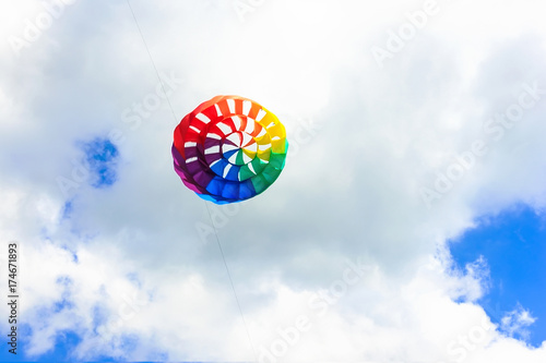 Fototapeta Naklejka Na Ścianę i Meble -  Colorful kite free to fly in the clear sky, a beautiful summer day,
