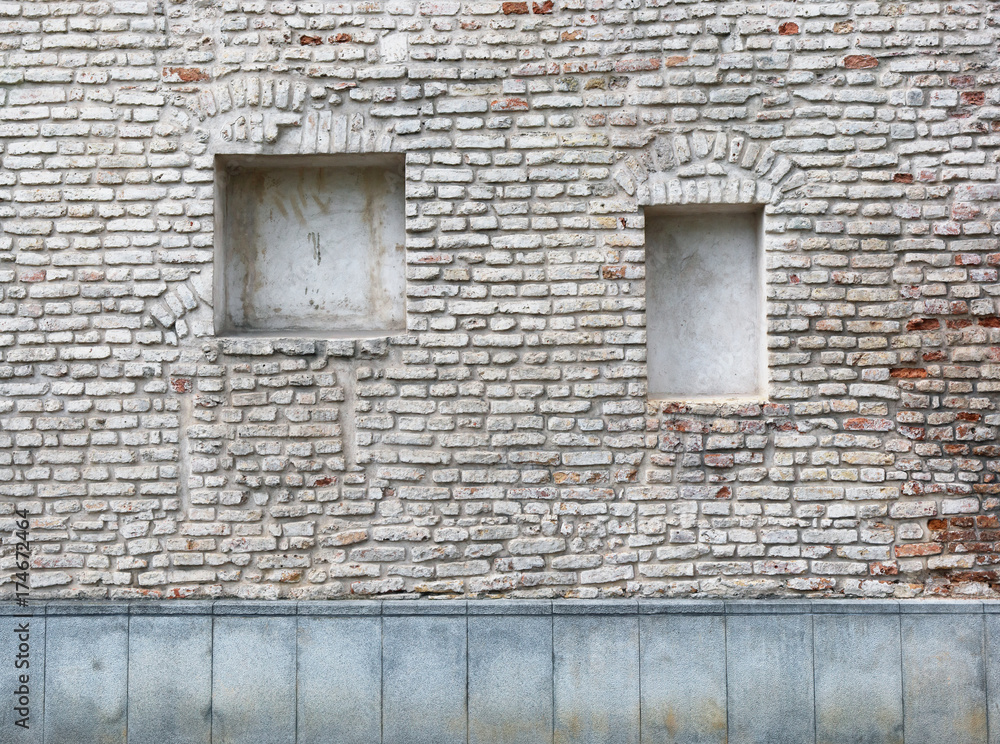 Blind curved basement windows in the old aged red bricks house Blind curved basement windows in the old aged red bricks house
