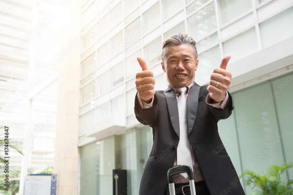asian senior business male outdoor with thumbs up asian senior business male outdoor with thumbs up