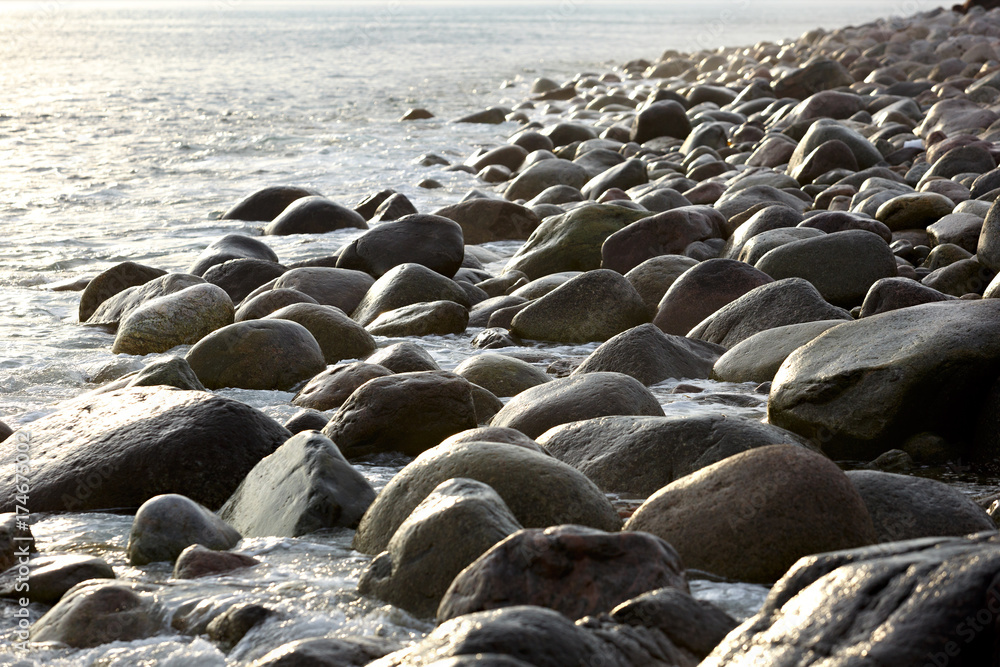 The coast, with stone boulders. Barents sea, Russia. The coast, with stone boulders. Barents sea, Russia.