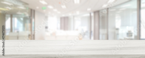 Marble stone tabletop and blurred bokeh office interior space background - can used for display or montage your products.