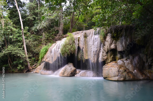 Fototapeta Naklejka Na Ścianę i Meble -  Scenic view of waterfall in the forest (place of fish),erawan waterfall national park,kanchanaburi,thailand 