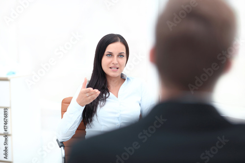 Severe female manager criticize her team member