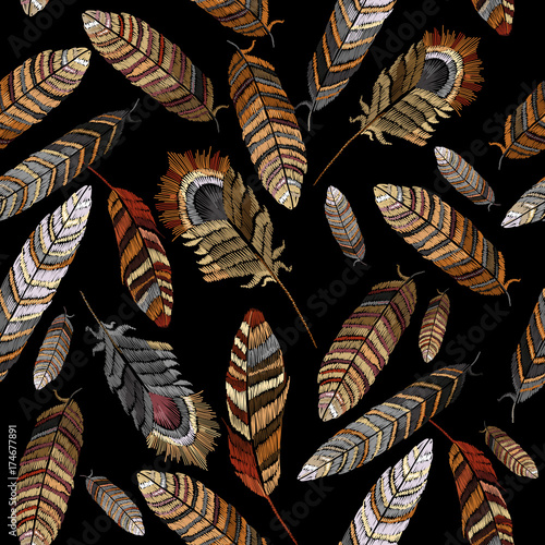 Color feathers embroidery seamless pattern. Beautiful bright tropical peacock feathers embroidery, hand drawn fashion template clothes, textiles, t-shirt design