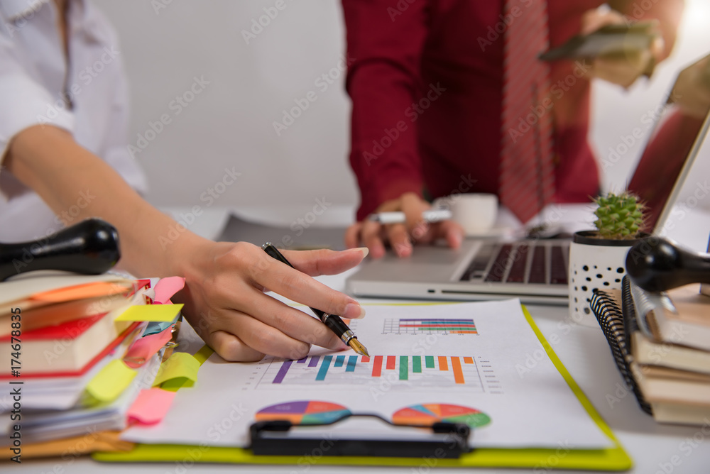businesswoman hand working with finances about cost and calculator