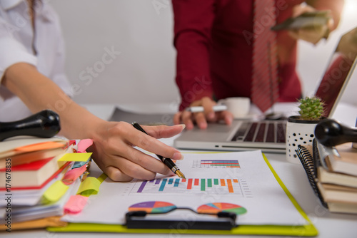 businesswoman hand working with finances about cost and calculator