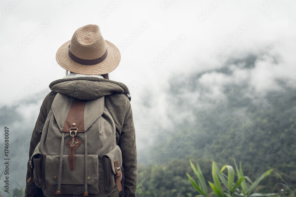Happy woman tourist to travel in wild trip  hiking during vacation.Travel concept.