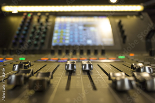 Close up of faders on a sound desk