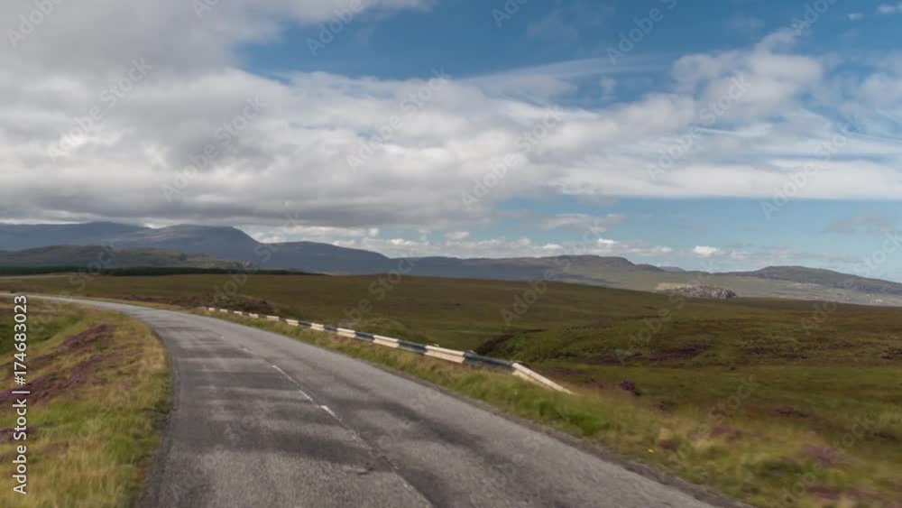 POV shot from a camera attached to the front of a vehicle driving through beautiful empty roads in the scottish highlands POV shot from a camera attached to the front of a vehicle driving through beautiful empty roads in the scottish highlands