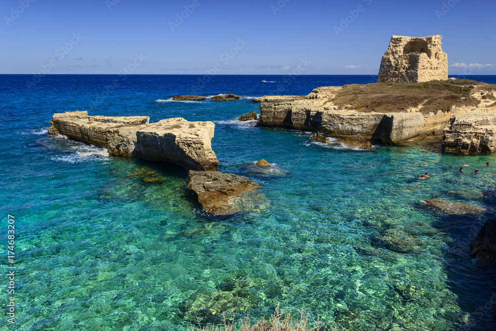 The most beautiful coast of Apulia: Roca Vecchia, ITALY (Lecce).Typical seascape of Salento: cliff and ruins of ancient coastal watchtower. 