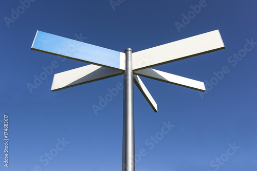 Blank sign post with blue sky background