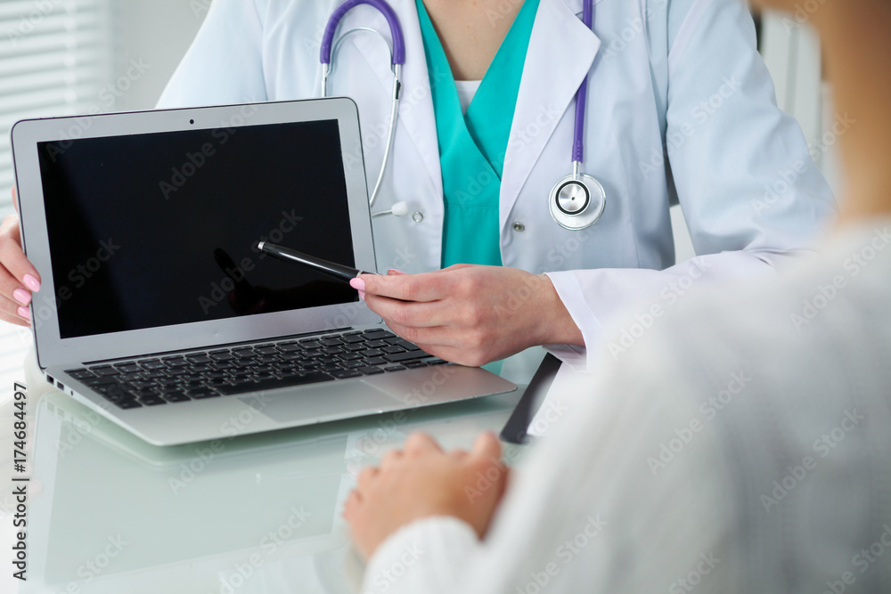 Doctor and patient, close-up of hands. Physician talking about medical examination results. Medicine, healthcare and helping concept Doctor and patient, close-up of hands. Physician talking about medical examination results. Medicine, healthcare and helping concept