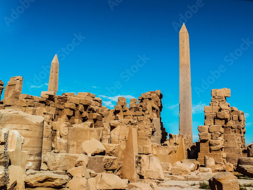 Egyptian Obelisk in the Karnak Temple in the middle of Ruins of the Pharaohs Era, Luxor, Egypt