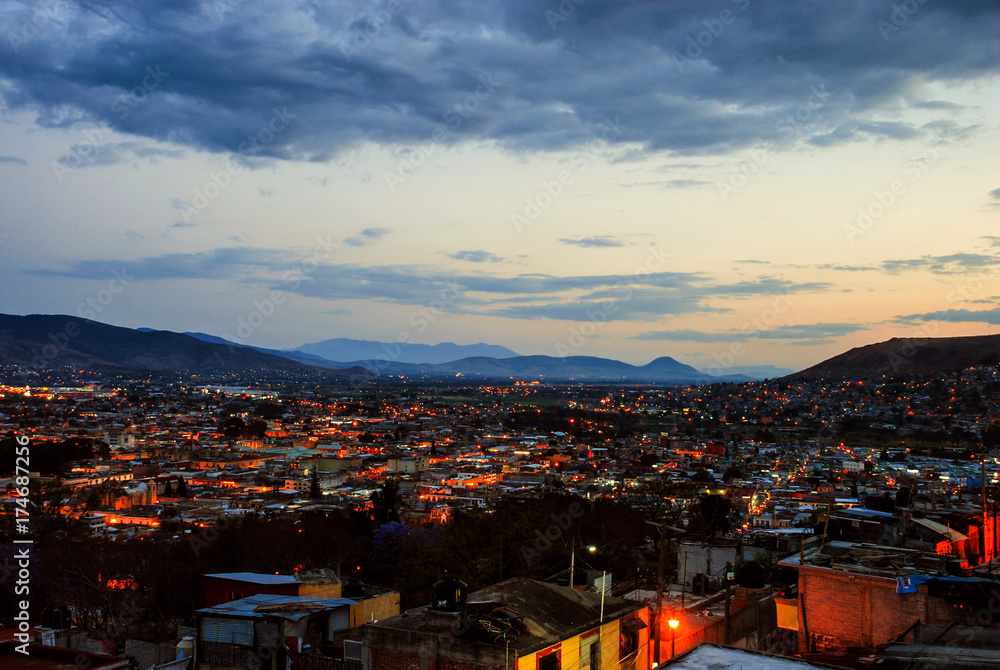 Aerial view of Puebla, Mexico at sunset. Mountains at the background