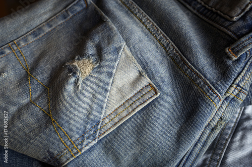 Details of blue jeans in zipper, pockets