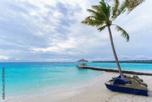 Fototapeta Naklejka Na Ścianę i Meble -  Paddleboats for tourists for steering on crystal clear turquoise sea in Maldives Island