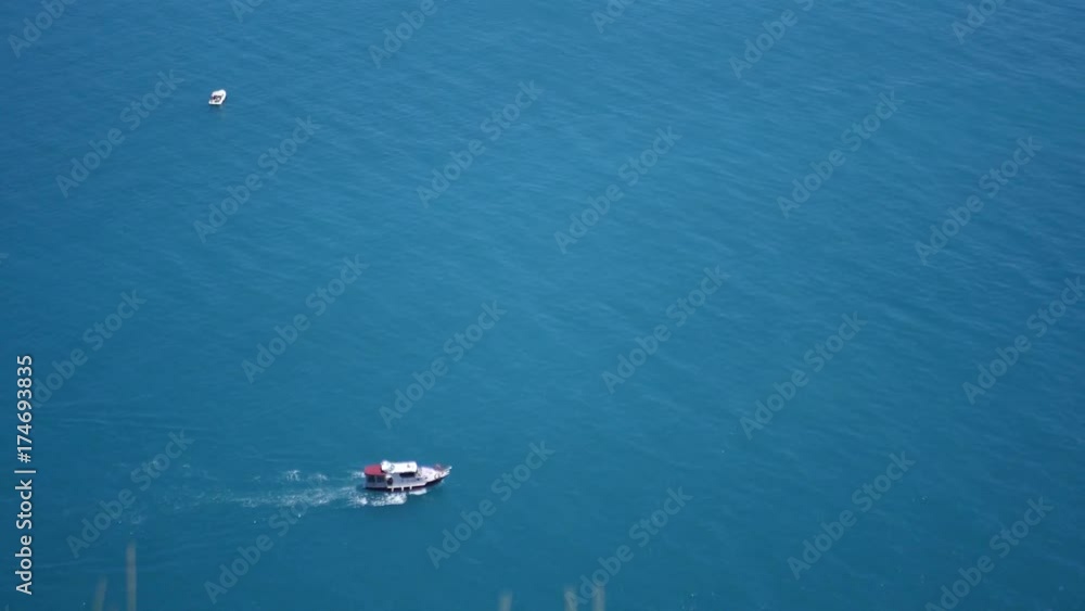 A small boat sails on the blue sea. 3840x2160, 4K A small boat sails on the blue sea. 3840x2160, 4K