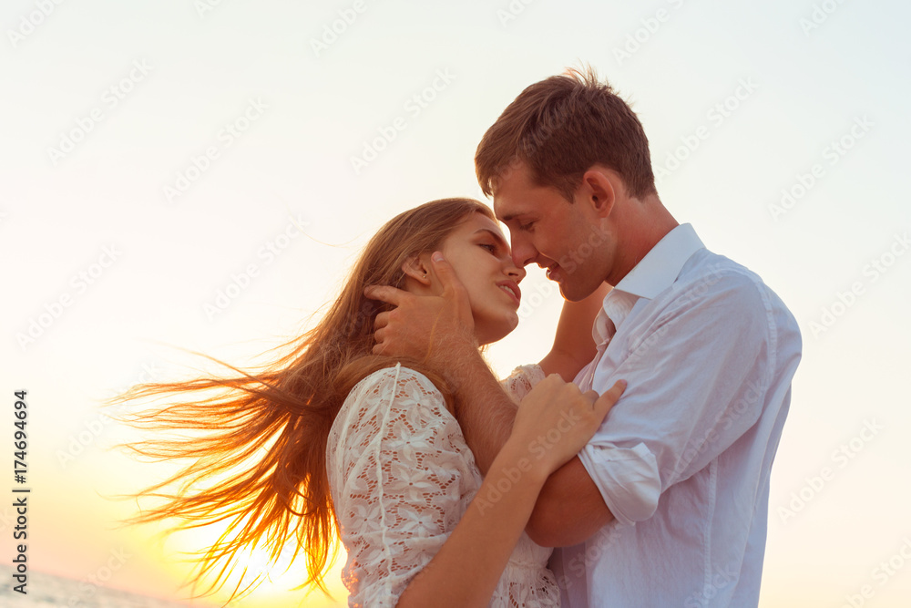 Romantic couple kissing on the beach Romantic couple kissing on the beach