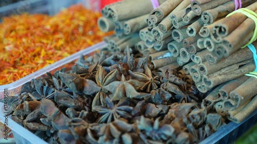 Spices, nuts, dried fruits on display at market on the counter, 4k, slow-motion photo