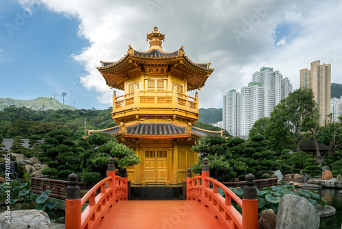 Photography Front view the Golden pavilion temple with red bridge in Nan Lian garden, Hong Kong